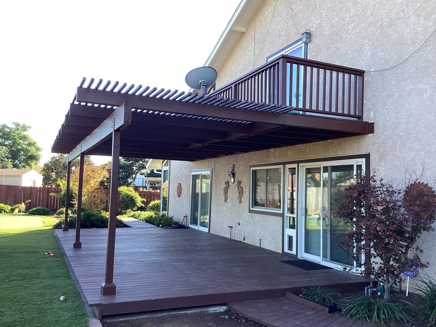A Deck with a Pergola on the Side of a House- Deck Painters in San Diego